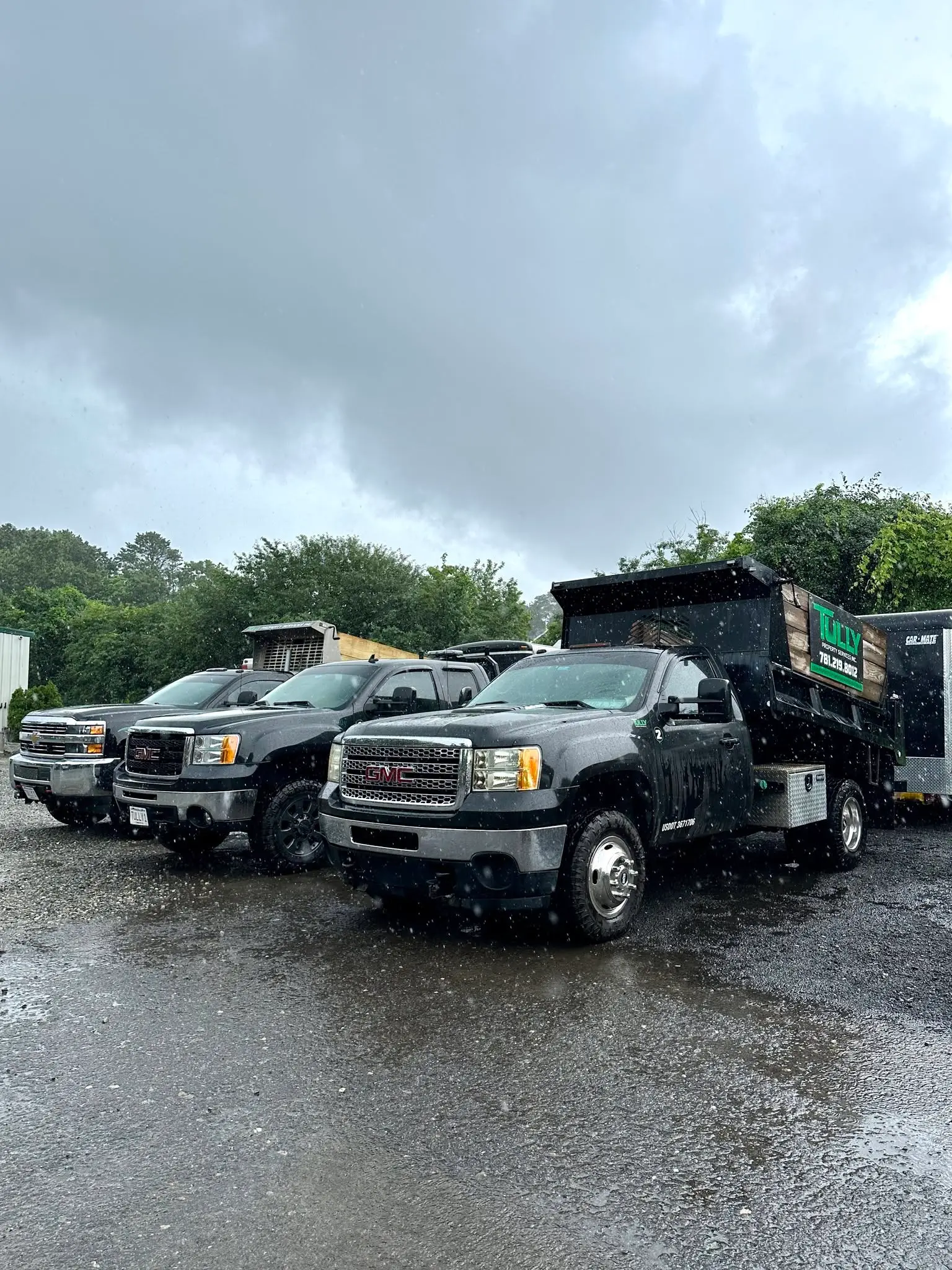 Tully’s work trucks with their green company signage