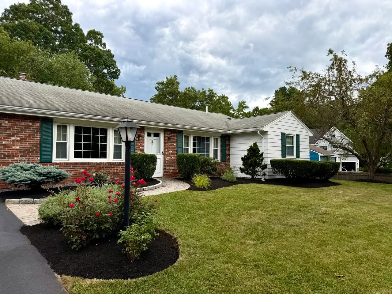 Completed Reading property with trimmed shrubs and defined mulch beds